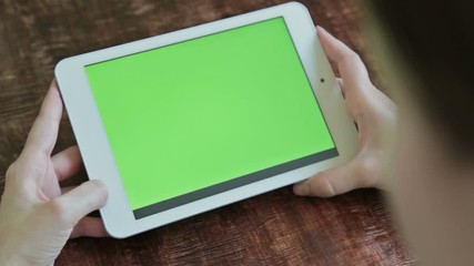 women using digital tablet computer with green screen 