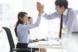 © Monet - Businessmen and business women have a high five