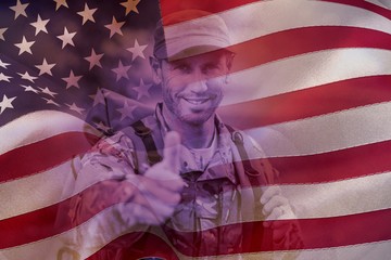 Poster - Composite image of portrait of happy army man with thumbs up