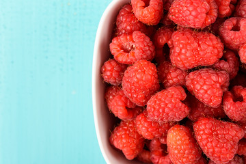 Wall Mural - White Bowl Of Red Fresh Raspberries