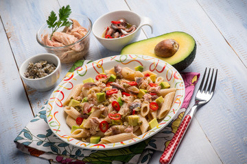 Wall Mural - pasta with tuna capers avocado and anchovy