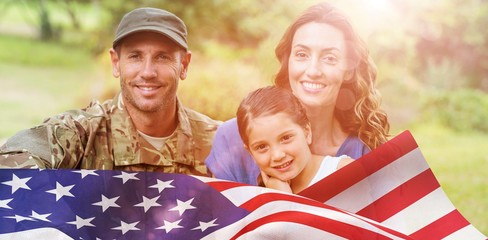 Wall Mural - Composite image of portrait of army man with family