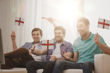 Wall Mural - happy male friends with flags and vuvuzela