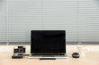 © dmnapat - Open laptop with external harddrive,  mouse, camera, smart phone
