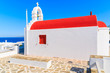 A traditional church with red roof on Mykonos island, Cyclades, Greece