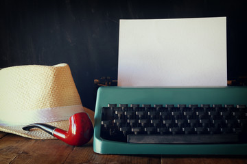 Wall Mural - vintage typewriter with blank page next to man accessories