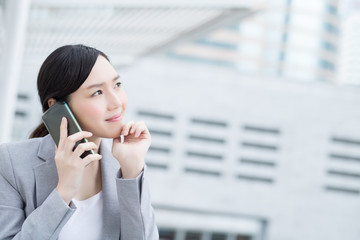 Wall Mural - business woman speak smart phone