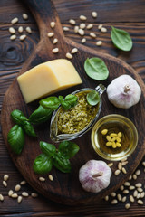 Wall Mural - Above view of ingredients for preparing pesto sauce, close-up