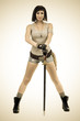 © StepStock - Styled portrait of young warrior woman holding sword