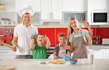 Poster - Happy family making pizza in kitchen