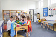© dglimages - Group of Children Playing in a Classroom