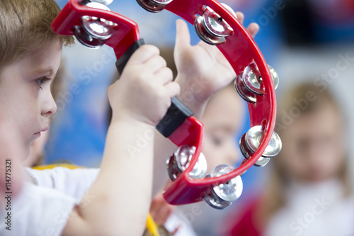Fotomural Boy Playing Tambourine at Nursery