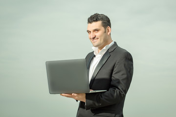 businessman with laptop outdoor