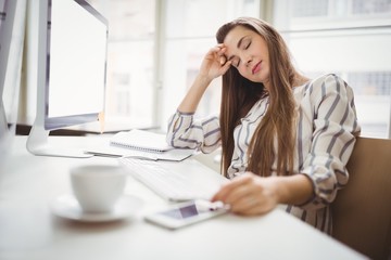 Businesswoman relaxing in creative office