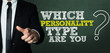 Business man pointing with the text: Which Personality Type Are You?