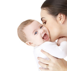 mother kissing adorable baby