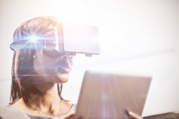 Poster - Businesswoman looking her tablet while using a virtual glasses