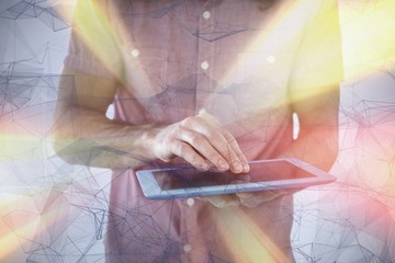 Poster - Composite image of mid section of hipster using digital tablet