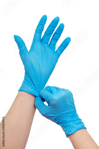 Fotografie, Obraz Doctor putting on protective gloves, isolated on white