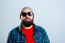 Bearded Man With Baseball Cap And Sunglasses Is Looking Angry
