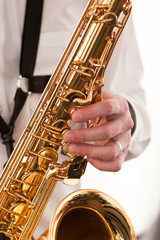 Poster - Saxophone musician in his hands closeup