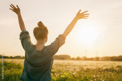Cuadros en Lienzo female teen girl stand feel freedom with arms stretched to the sky