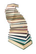 © evgenyi - stack of books closeup isolated on white background