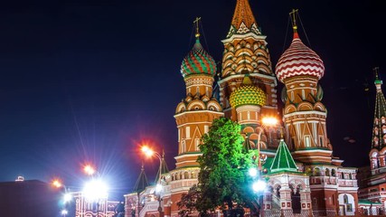 Sticker - Time-lapse. Saint Basil Cathedral on Red Square at night with Kremlin Tower, Moscow. One of the most popular landmark in Russia. The building is shaped as a flame of a bonfire rising into the sky