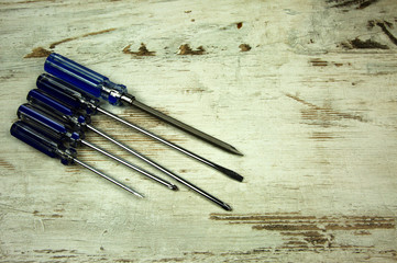 Set of screwdrivers on a wooden table