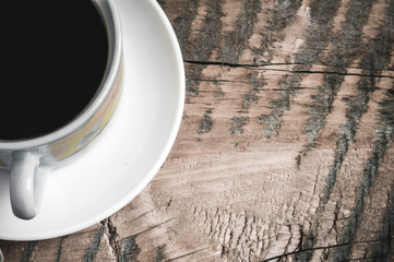 Coffee Mug on a wooden table with a white cloth. Working environment. Rest.