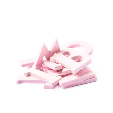 Pile of colorful wooden letters isolated