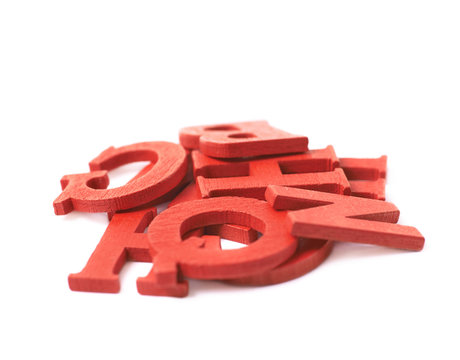Pile of colorful wooden letters isolated