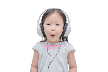 Wall Mural - Little asian girl listening music by headphone