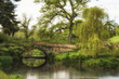 Stunning landscape image of old medieval bridge over river with