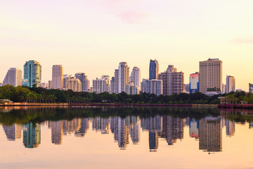 Bangkok city sunrise reflection river of sun. Panoramic view light blue background of glass high rise building skyscraper commercial of future. Business concept of success industry tech architecture