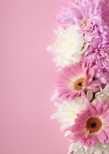 A Border Of White And Pink Flowers On A Pastel Background