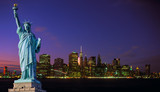 Fototapeta  - Manhattan skyline at night and Statue of Liberty.