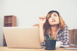 © Johnstocker - young beautiful hipster woman sitting on workplace and thinking