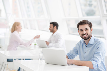 Handsome businessman working in his office