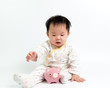Asian baby with piggy bank