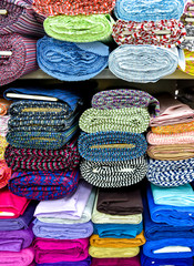 Wall Mural - Rolls of fabric and textiles in a factory shop.