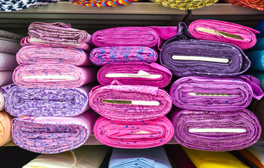 Wall Mural - Rolls of fabric and textiles in a factory shop.