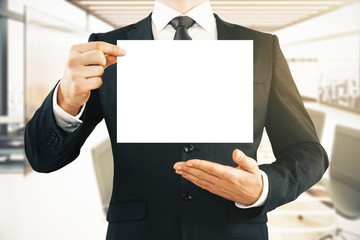 Wall Mural - Man holding blank whiteboard