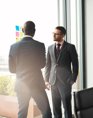 Canvas Print - Serious young businessman talking to a colleague