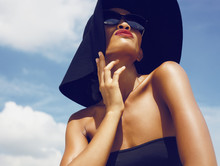 Glamour Model In Hat Under Sun