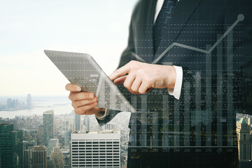 Canvas Print - Businessman using tablet with chart