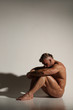 © kazanovskyiphoto - One young naked handsome man with sexy strong muscular body