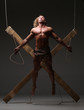 © kazanovskyiphoto - Sexual naked man, muscular, hands tied rope to wooden beams
