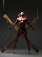 Wall Mural - Sexual naked man, muscular, hands tied rope to wooden beams