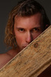 © kazanovskyiphoto - Portrait young sexual strong Men with wooden beams